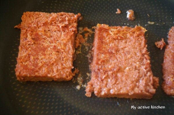 corned beef in a frying pan.