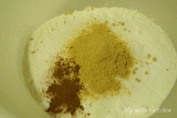 image of flour ginger, sugar and all spices in a mixing bowl
