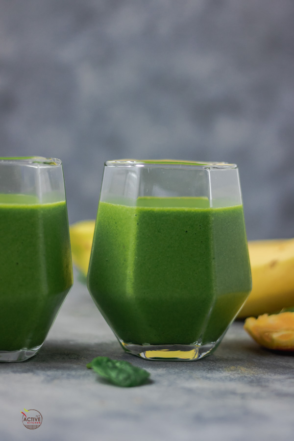 green smoothie in two glasses.