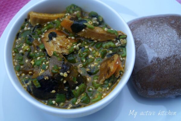 okro soup in a bowl served with amala dudu.