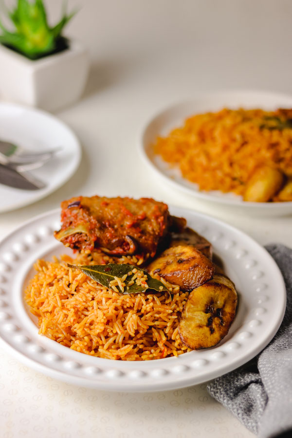 Nigerian smoky jollof rice served with peppered turkey and fried plantain.