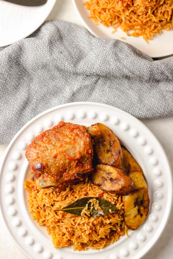 Nigerian smoky jollof rice served with peppered turkey and fried plantain.