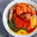 a bowl of gbegiri, amala and ewedu.