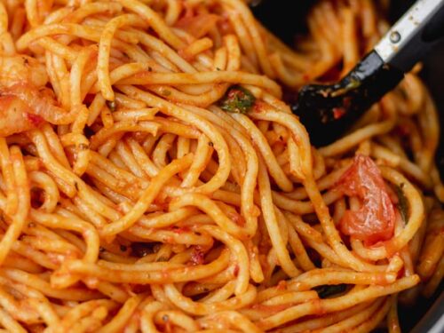 spaghetti jollof in a pan.