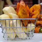 fried yam and plantain in a basket.