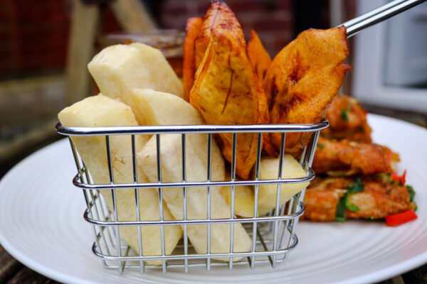 fried yam and plantain in a basket.