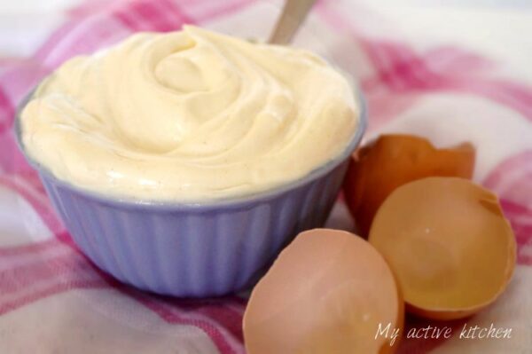 homemade mayonnaise in a purple ramekin.