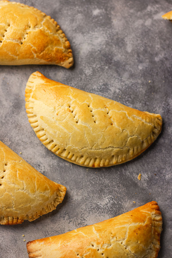 photographs of meat pies laid flat on a grey backdrop