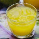 mango lemonade in a glass cup.