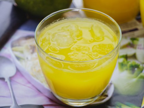 mango lemonade in a glass cup.