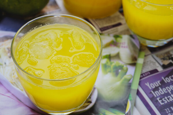 overhead shot of mango lemonade filled with ice.