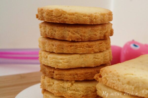 stack of freshly baked coconut shortbread cookies.