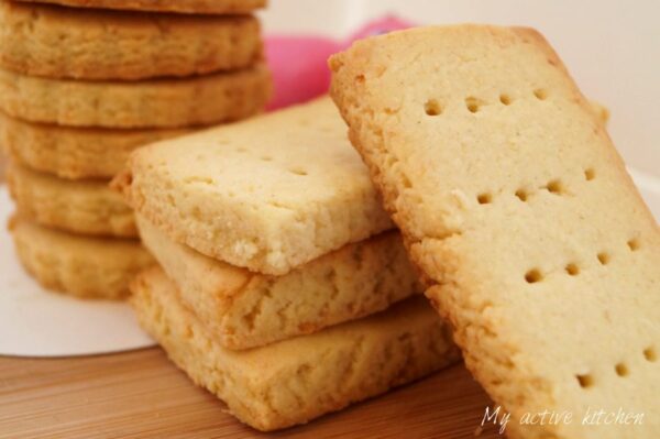 stack of freshly baked coconut shortbread cookies.