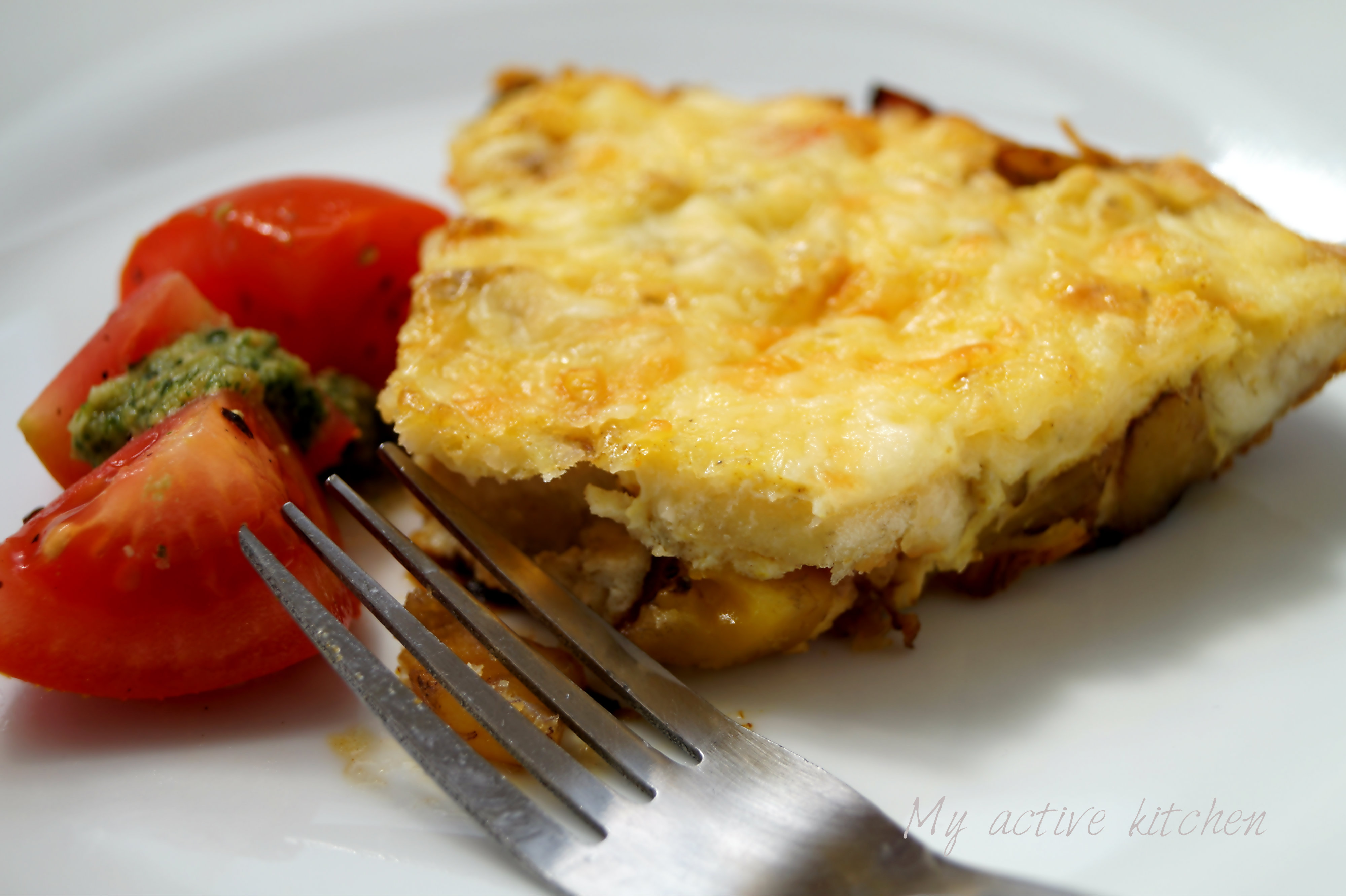 tomato and homemade pesto with yam and plantain frittata