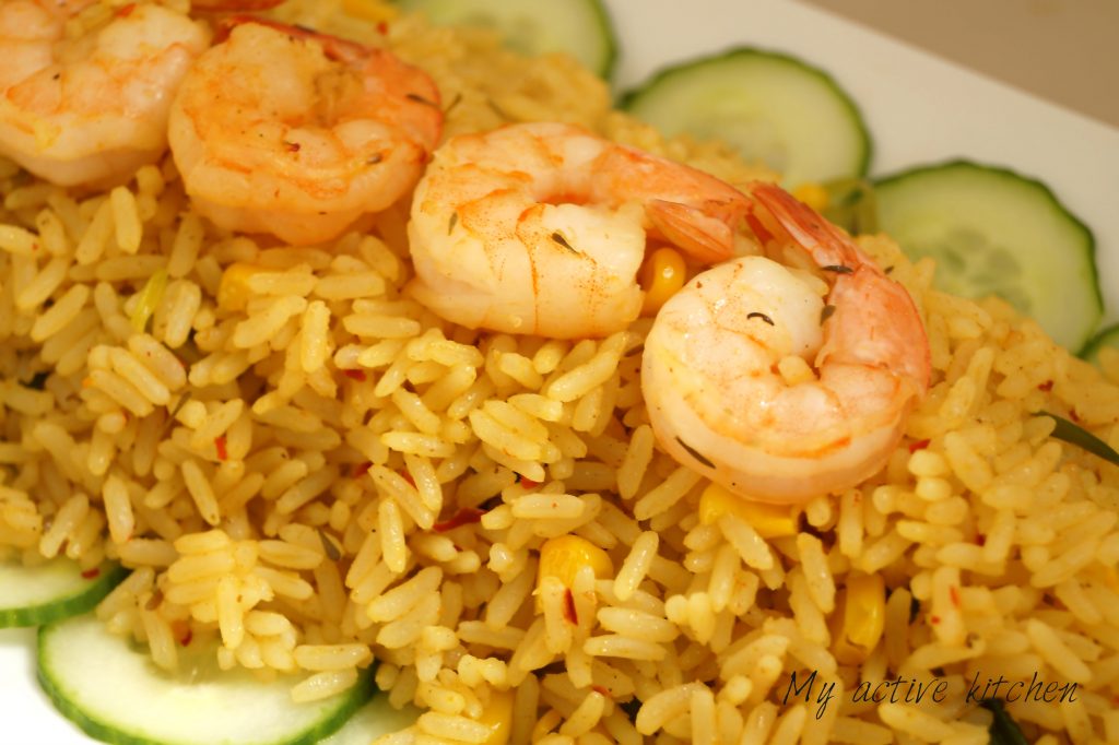 coconut rice and shrimps with sliced cucumber