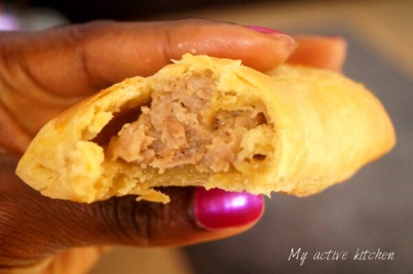 a close photograph of bitten sausage roll