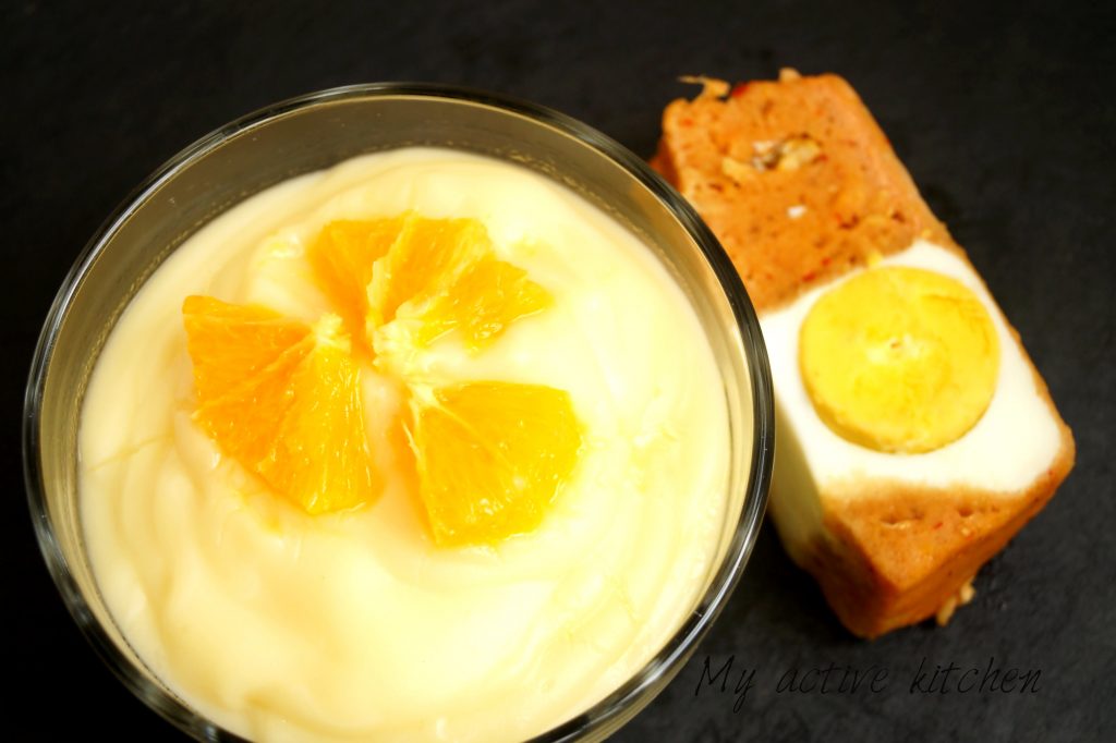 akamu served in a bowl, garnished with segments of orange. to be paired with moi moi