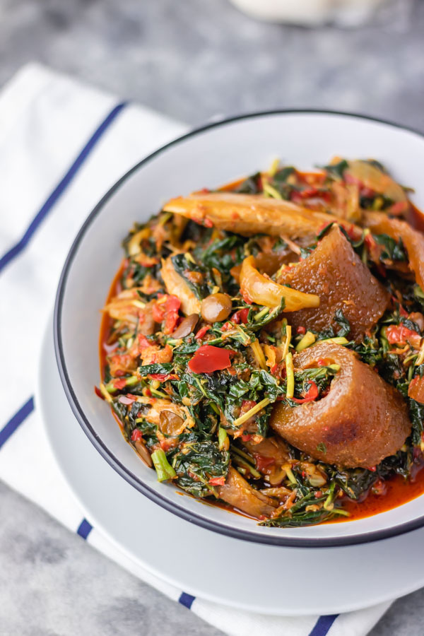 efo riro in a bowl placed over a napkin.