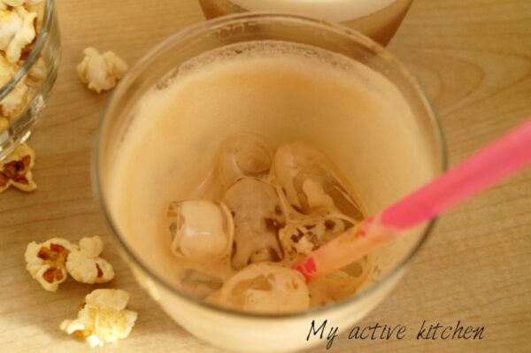 empty glass with milk froth on the sides. the glass have some ice in it