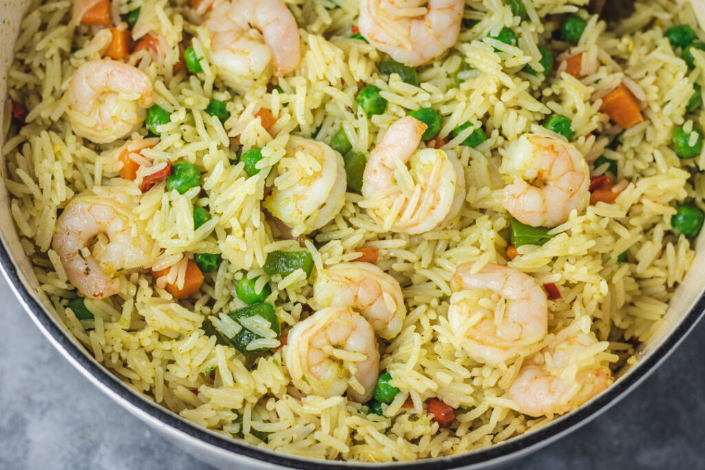 a pot of rice with shrimps.