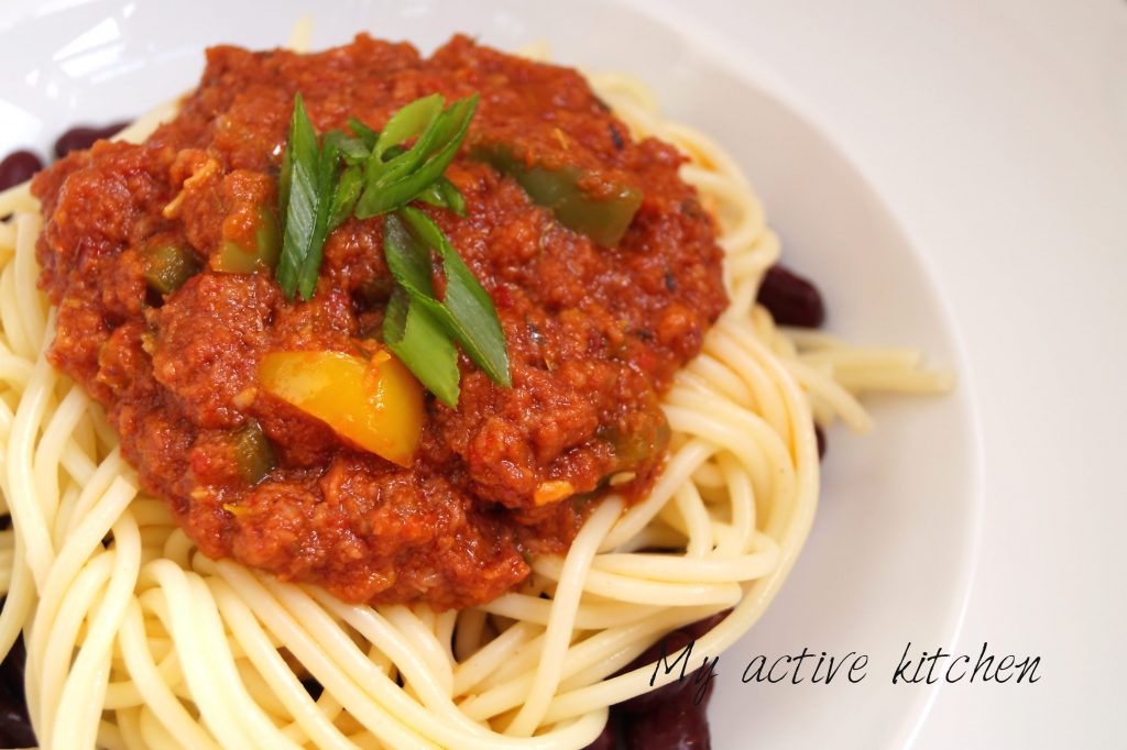 image of corned beef stew on spaghetti and kidney beans. This dish would make a perfect lunch