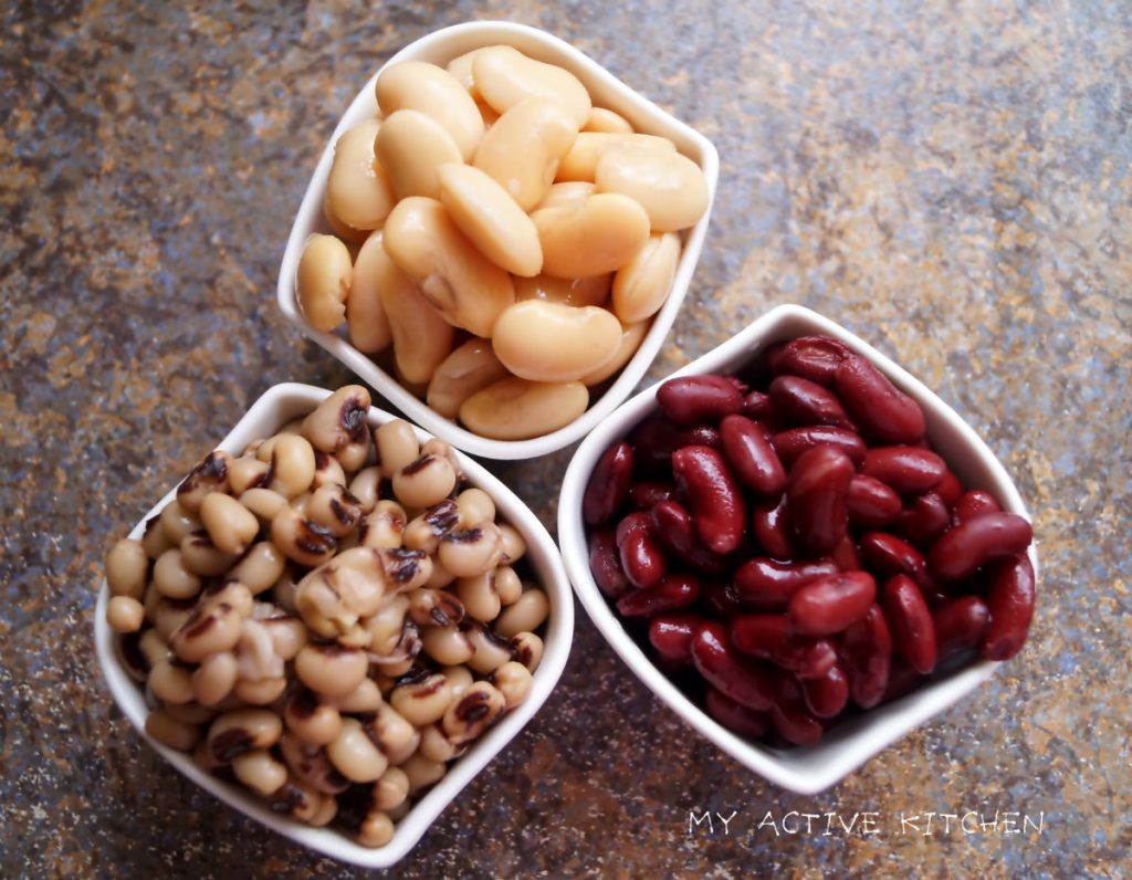 image of 3 white ramekins filled with 3 different types of beans. red kidney beans, butter beans and black eyed peas