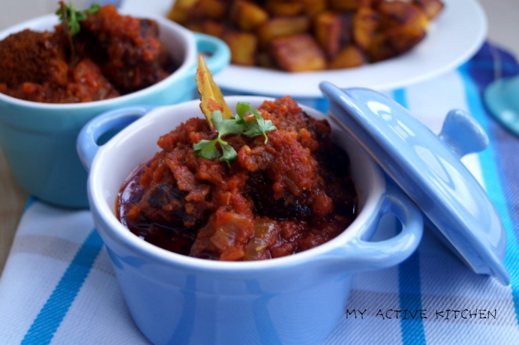 two blue ramekins containing stew