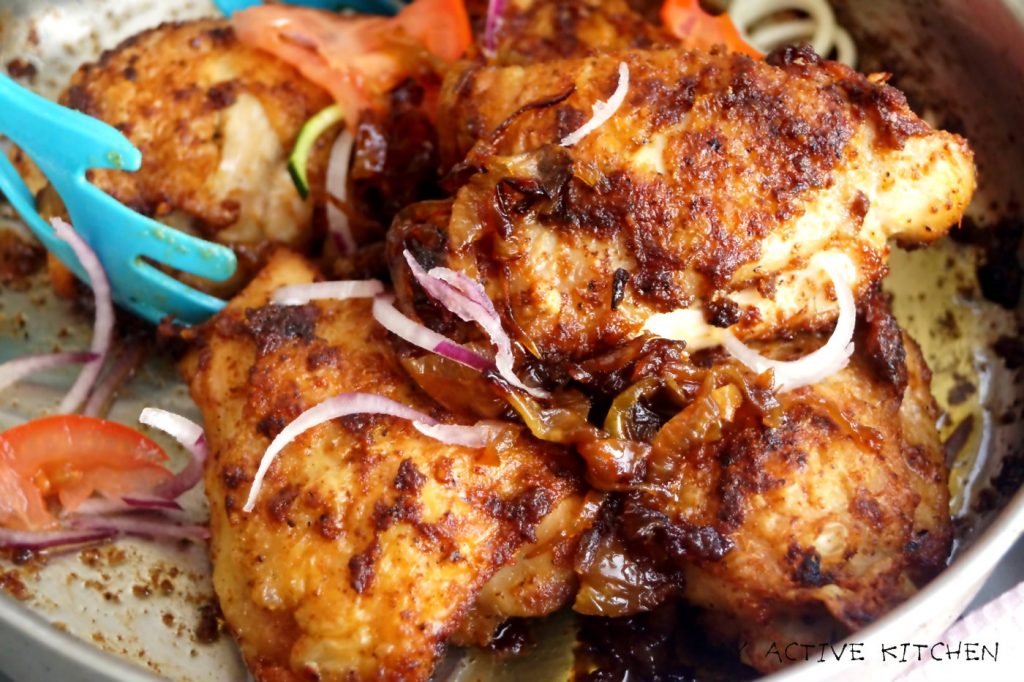 baked chicken suya in a skillet.