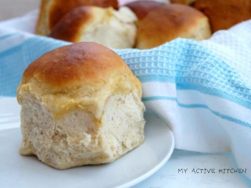 dinner rolls on a blue napkin