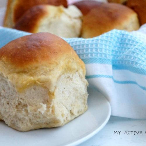 dinner rolls on a blue napkin