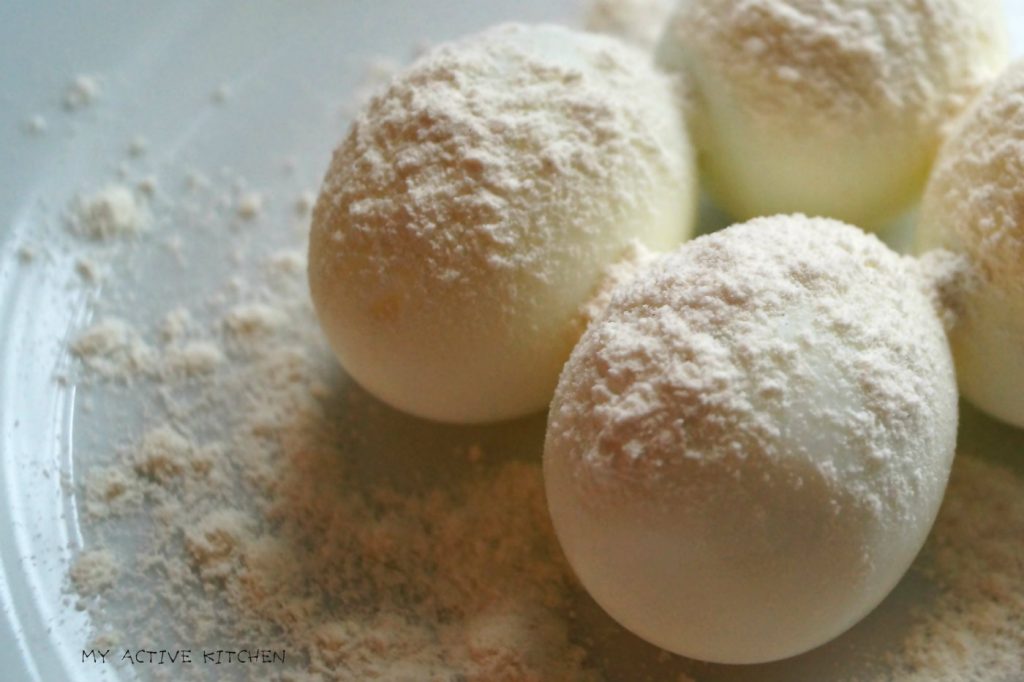 foru boiled eggs on a bowl with a dusting of flour