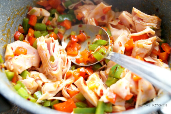 chopped ham and peppers in a pot