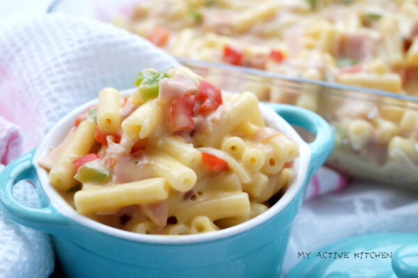 mac and cheese with peppers in a small blue ramekin