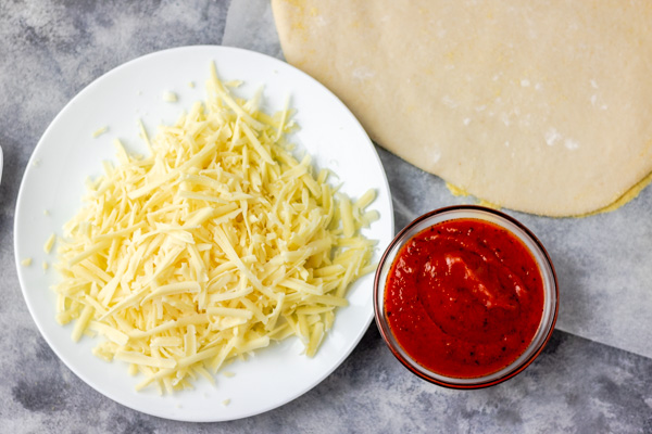 instant pizza dough, tomato sauce and grated cheese.