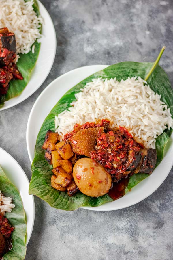 overhead shot of ofada stew recipe served with plain white rice.