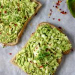 slices of avocado egg salad made with avocado, eggs, herbs, salt and pepper