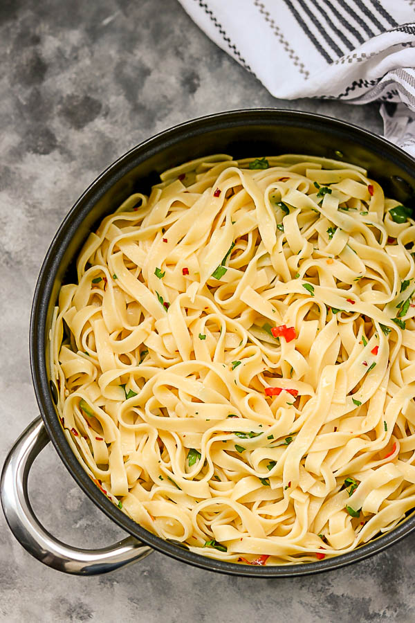 a close shot of tagliatelle in a pan