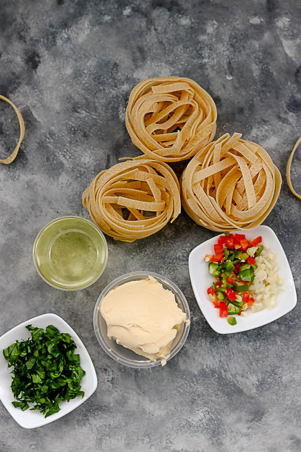 image of uncooked pasta, butter, olive oil and chopped chillies