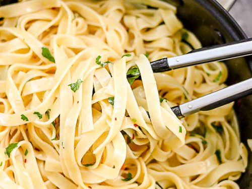 a close shot of tagliatelle in a pan