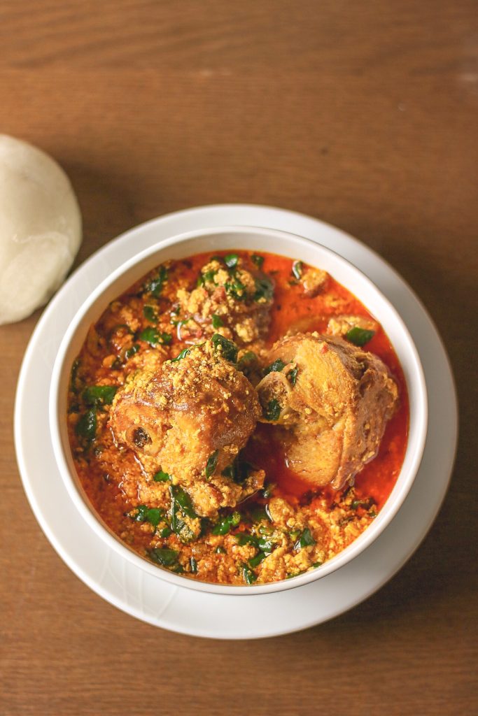 overhead shot egusi soup and pounded yam.