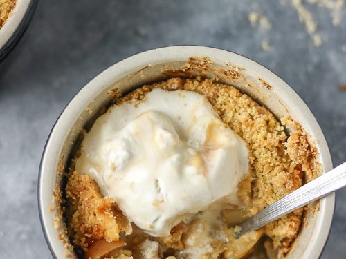 a close shot of apple crumble in a ramekin