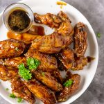 crispy and sticky asian chicken wings! this is an all rounder chicken recipe for all occasions, coated in honey, garlic and soy sauce, this sticky chicken wings is very easy to make too. www.myactivekitchen.com