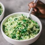 a close shot of spanakorizo in a white bowl