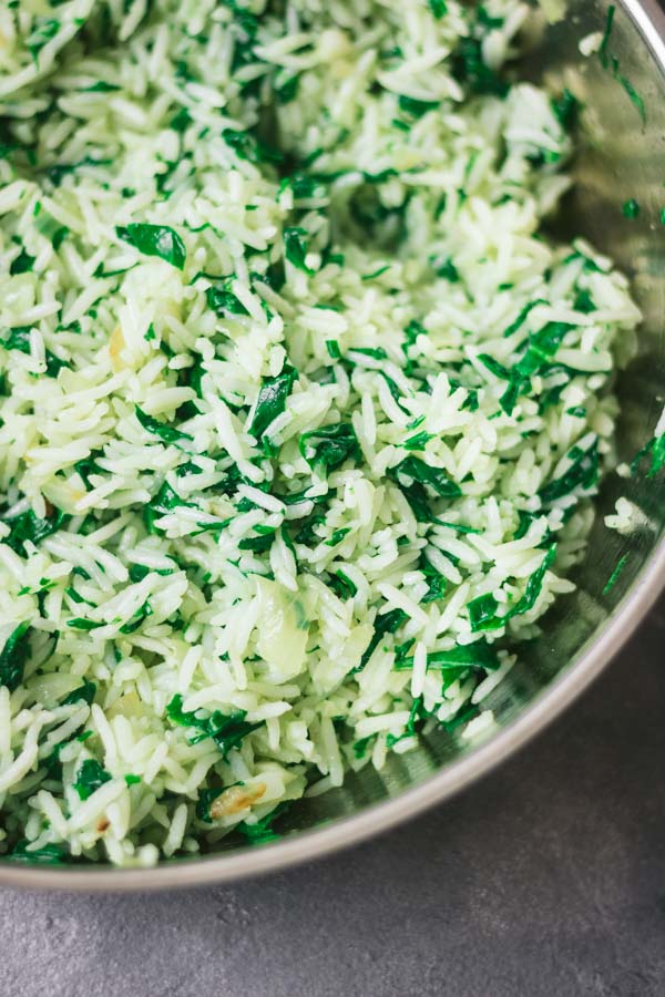 close shot of spinach rice just cooked in a pan