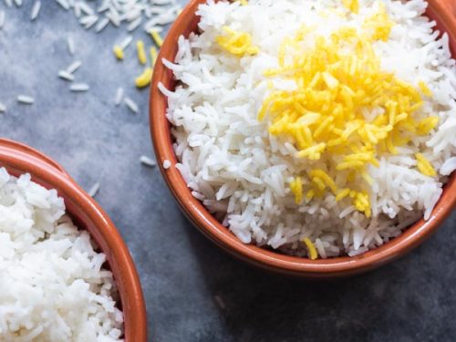 perfect basmati rice seved in a brown ceramic bowl.