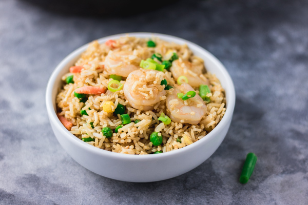 shrimp fried rice in a white bowl.