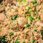 shrimp fried rice in a work with wooden ladle.