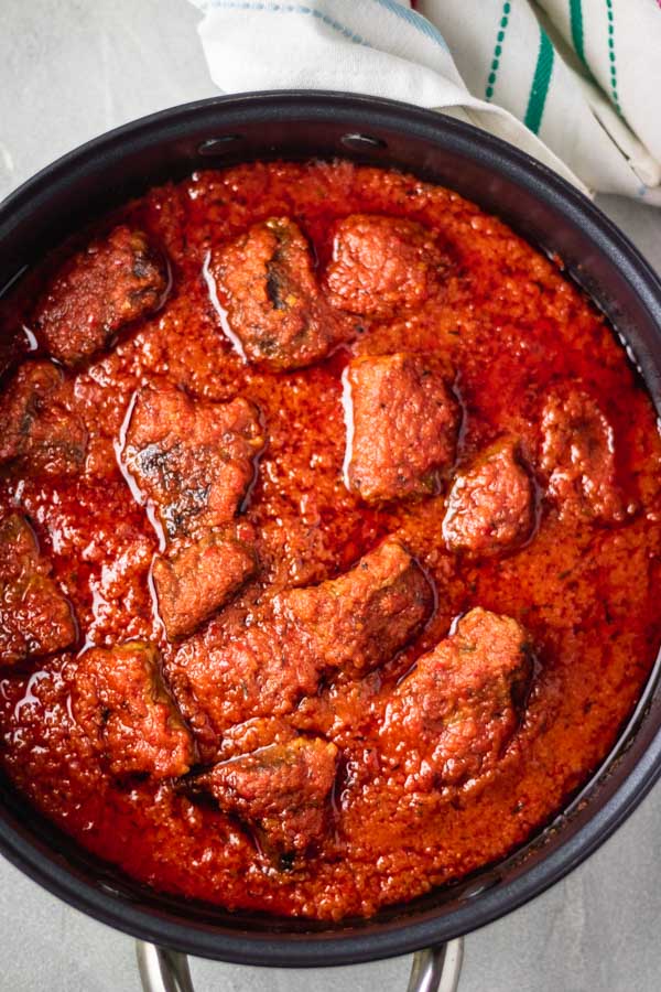 overheat shot of nigerian beef stew (african stew) in a large saucepan