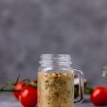 homemade italian dressing in a small mason jar.