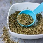 homemade italian seasoning mix in a white small bowl.